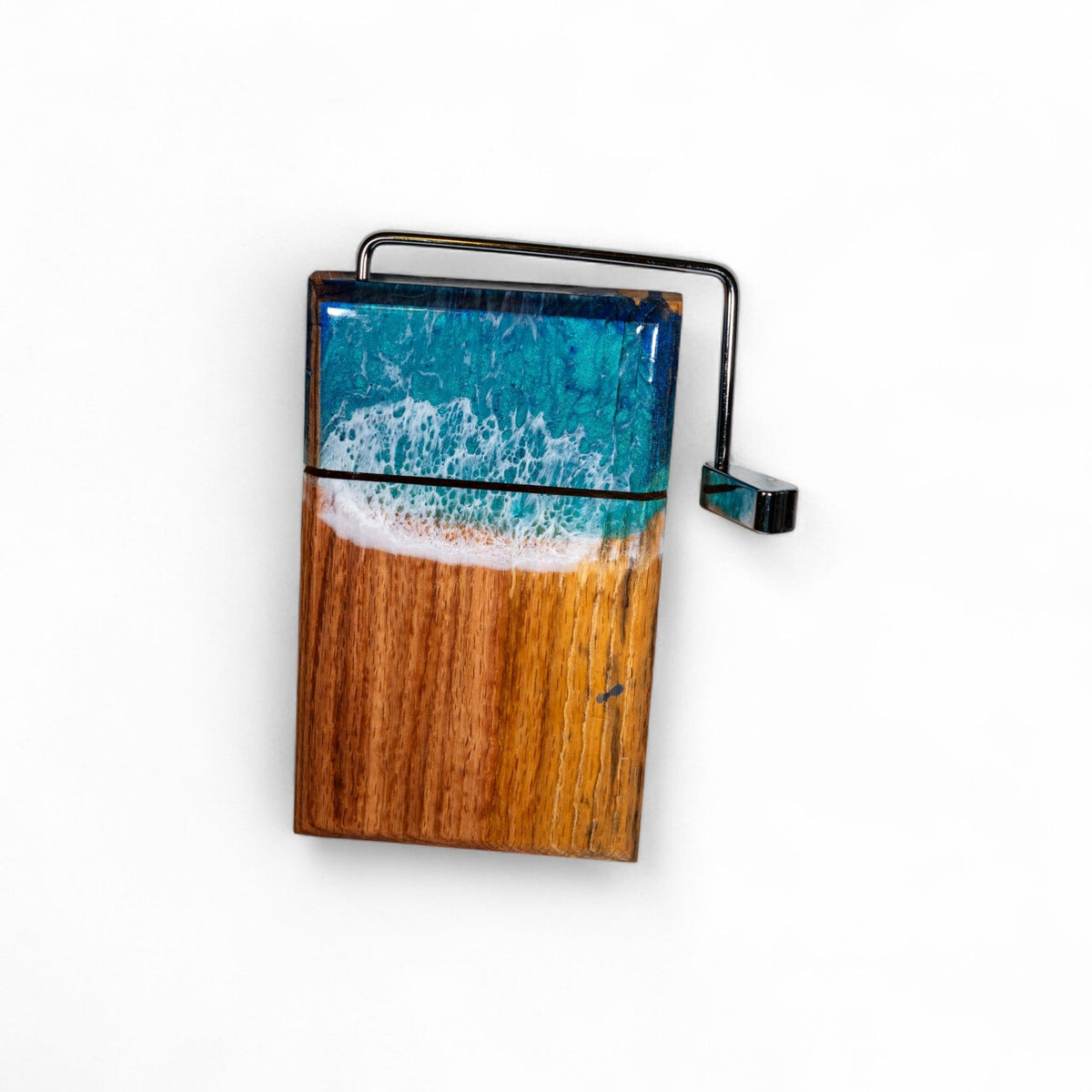 Side profile of thick wooden cheese board featuring embedded blue resin wave design