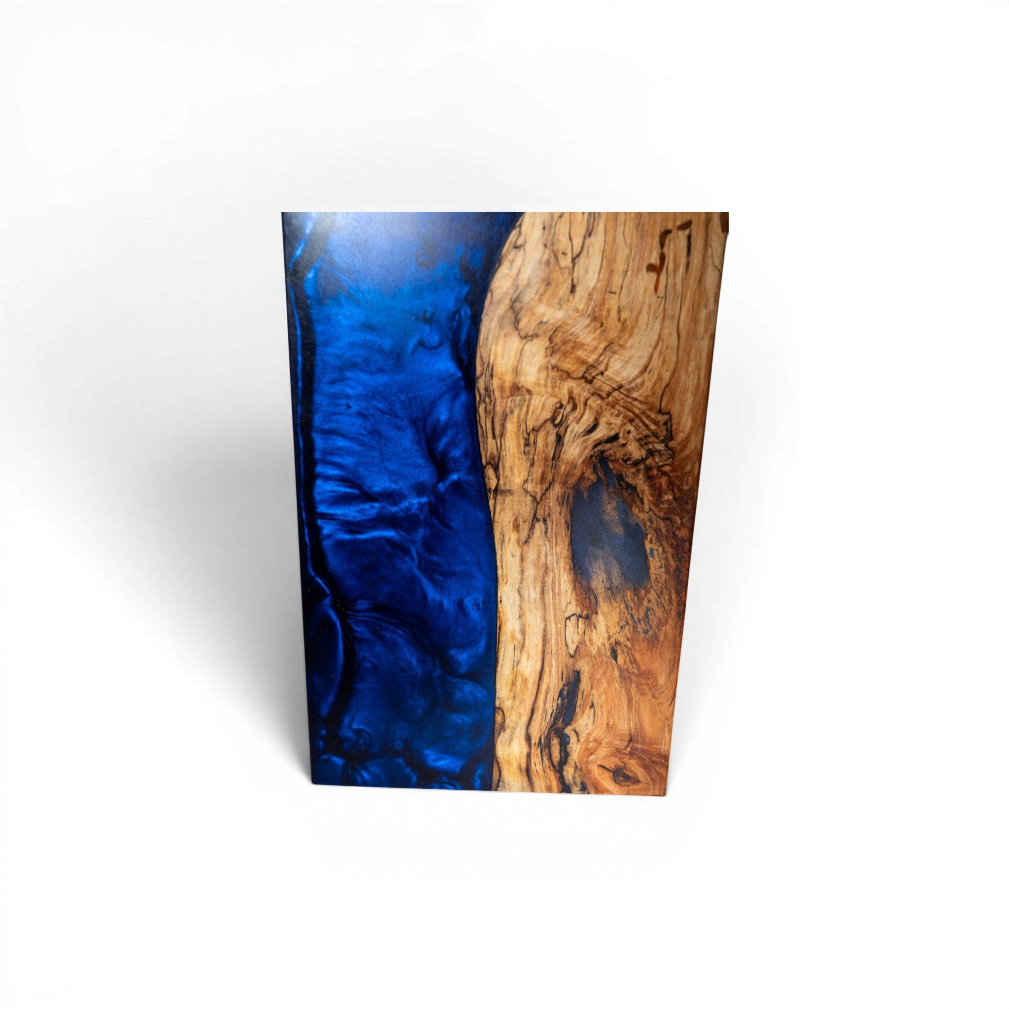 Diagonal split dark blue epoxy and natural maple wood cutting board