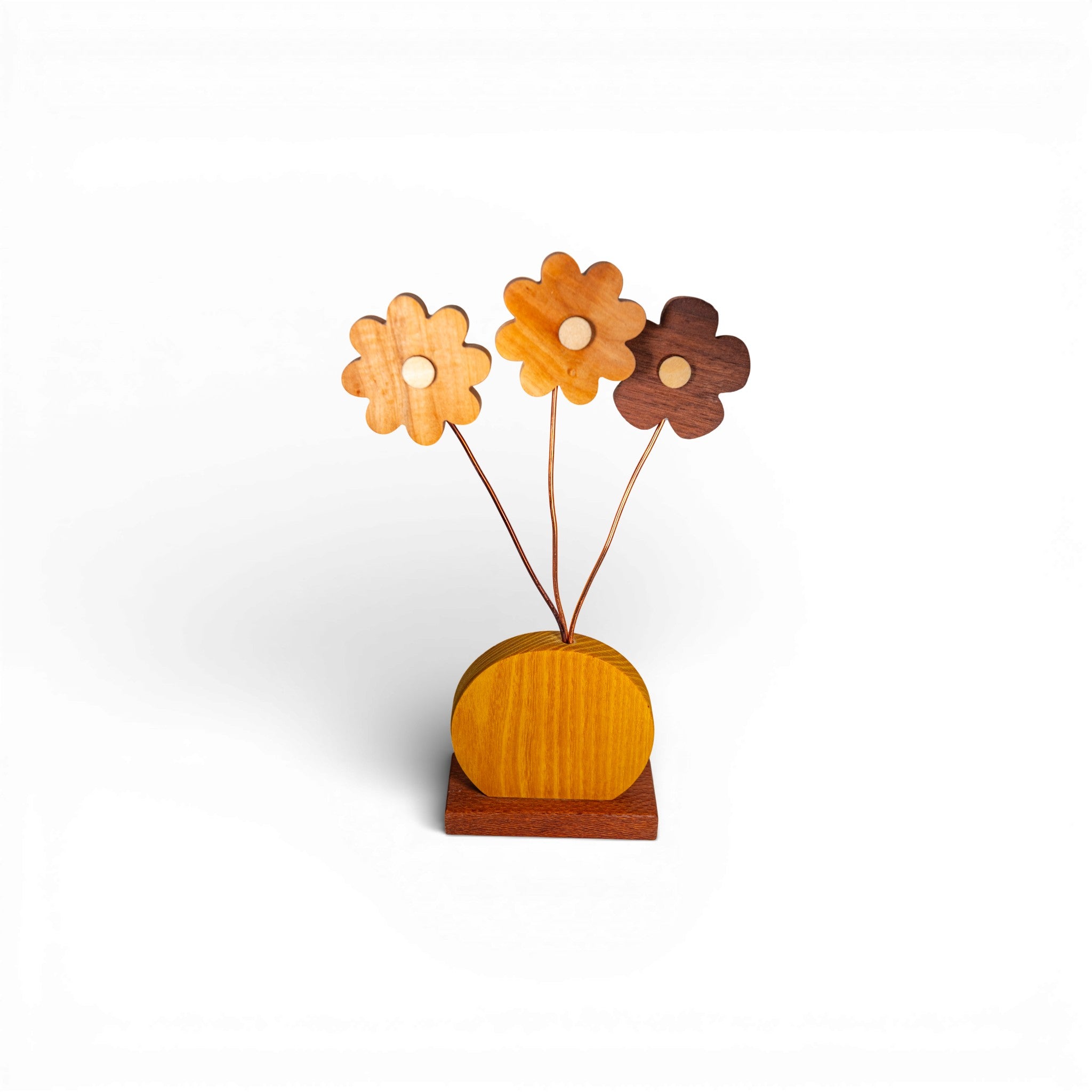 Handmade wooden daisy bouquet with natural wood tones and copper wire stems on yellow base