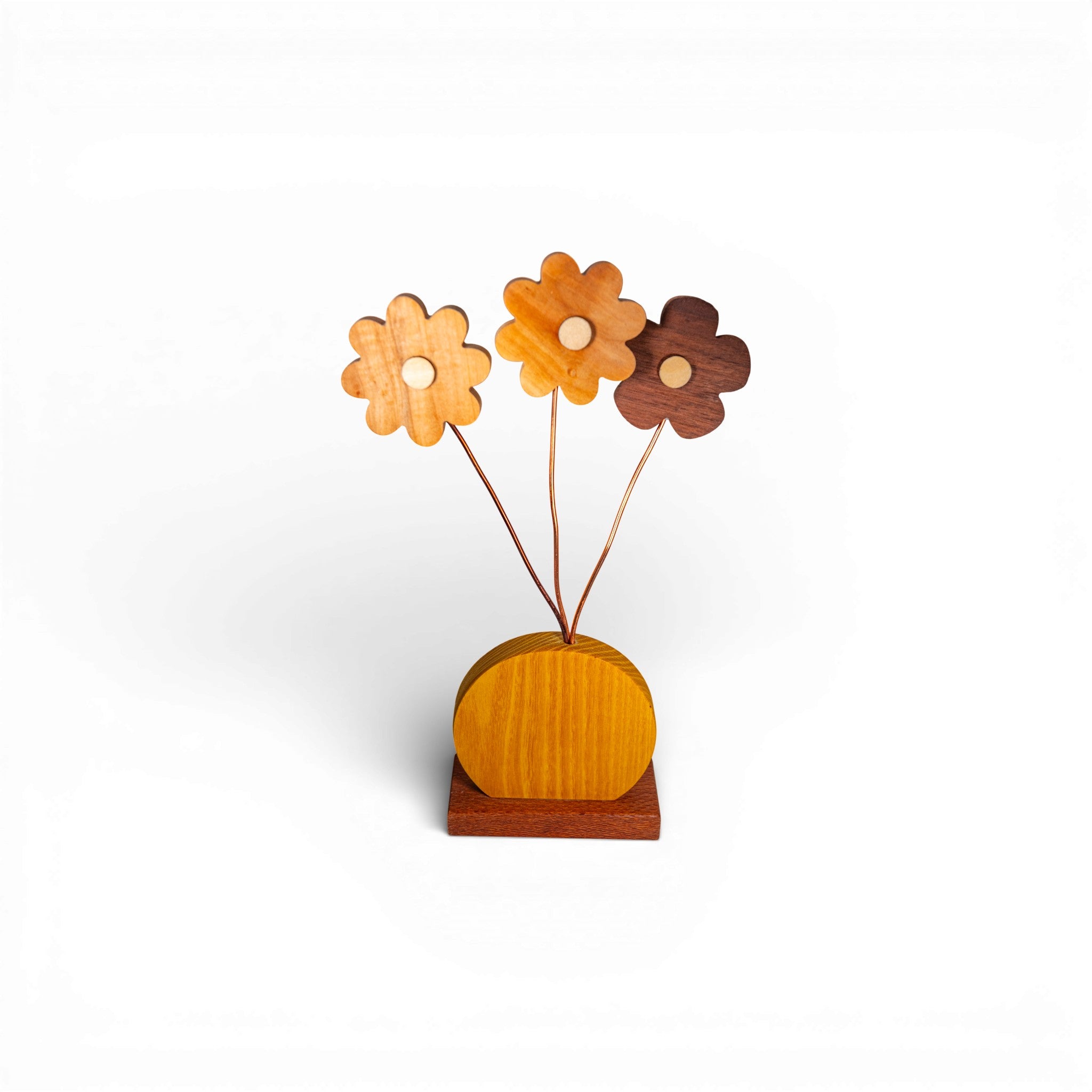 Three-tone wooden daisy flower arrangement with varied grain patterns and copper stems