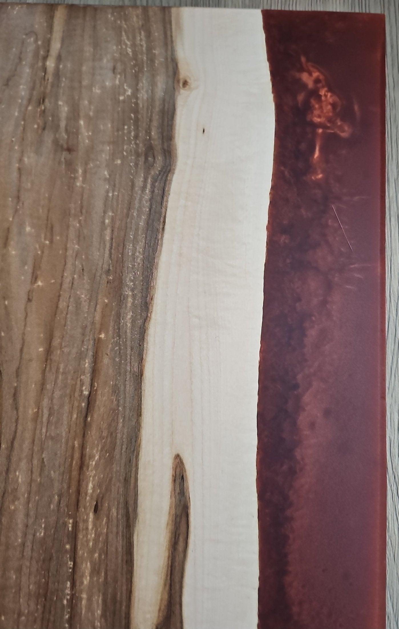Textured maple grain and smooth copper epoxy contrast on charcuterie board