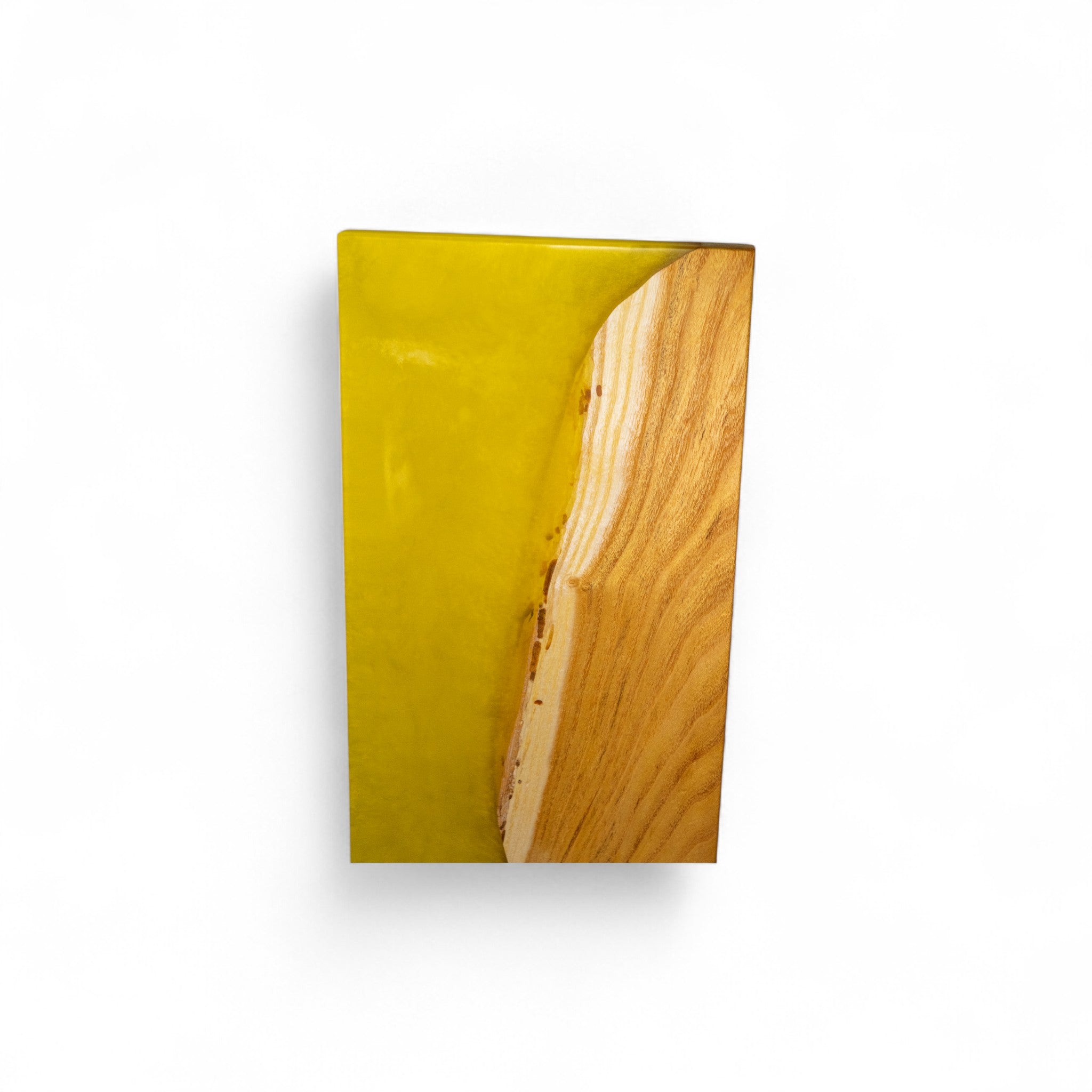 Close-up of handmade mulberry wood and yellow epoxy serving board grain
