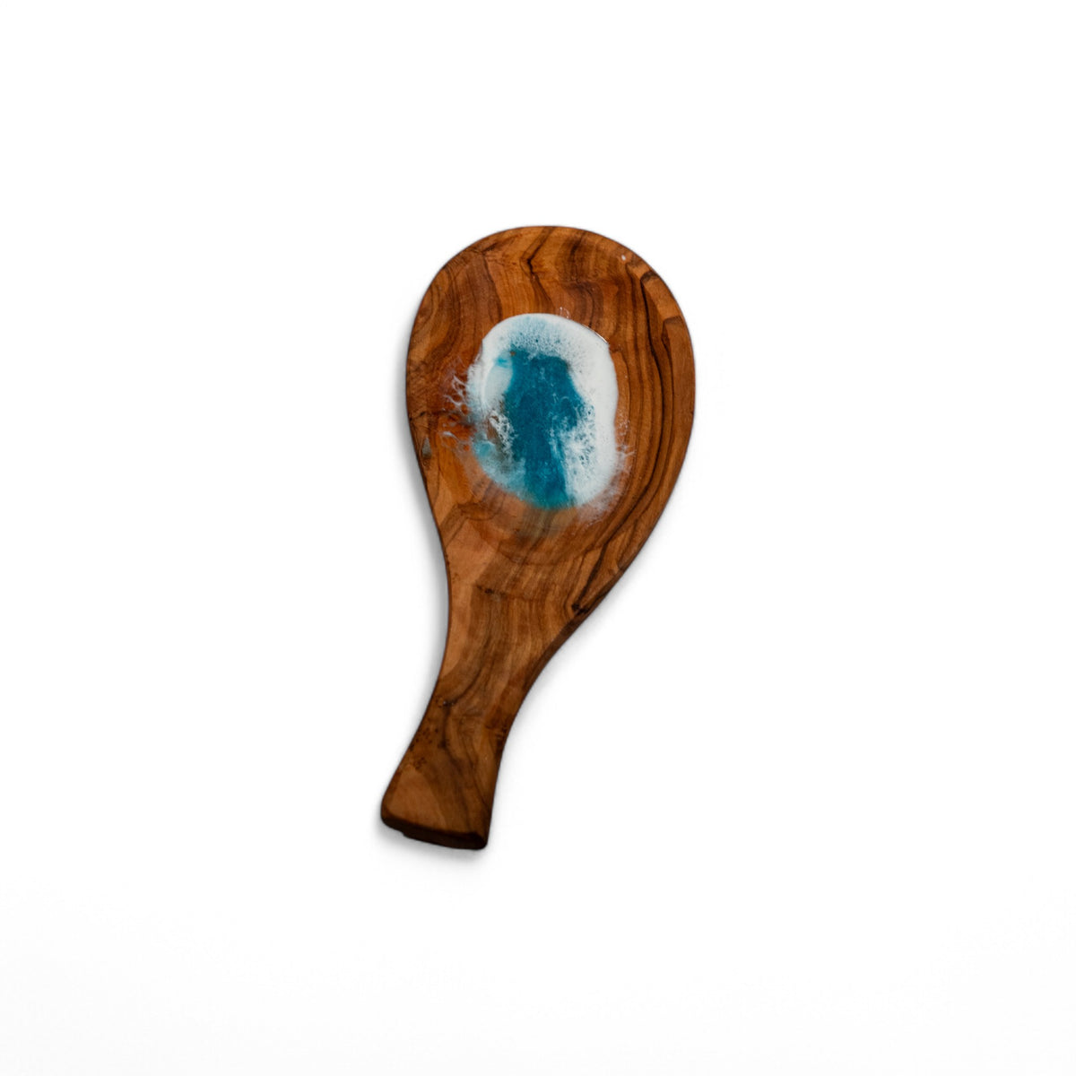 Top-down view of teardrop olive wood spoon rest featuring swirling grain and captured ocean wave resin detail