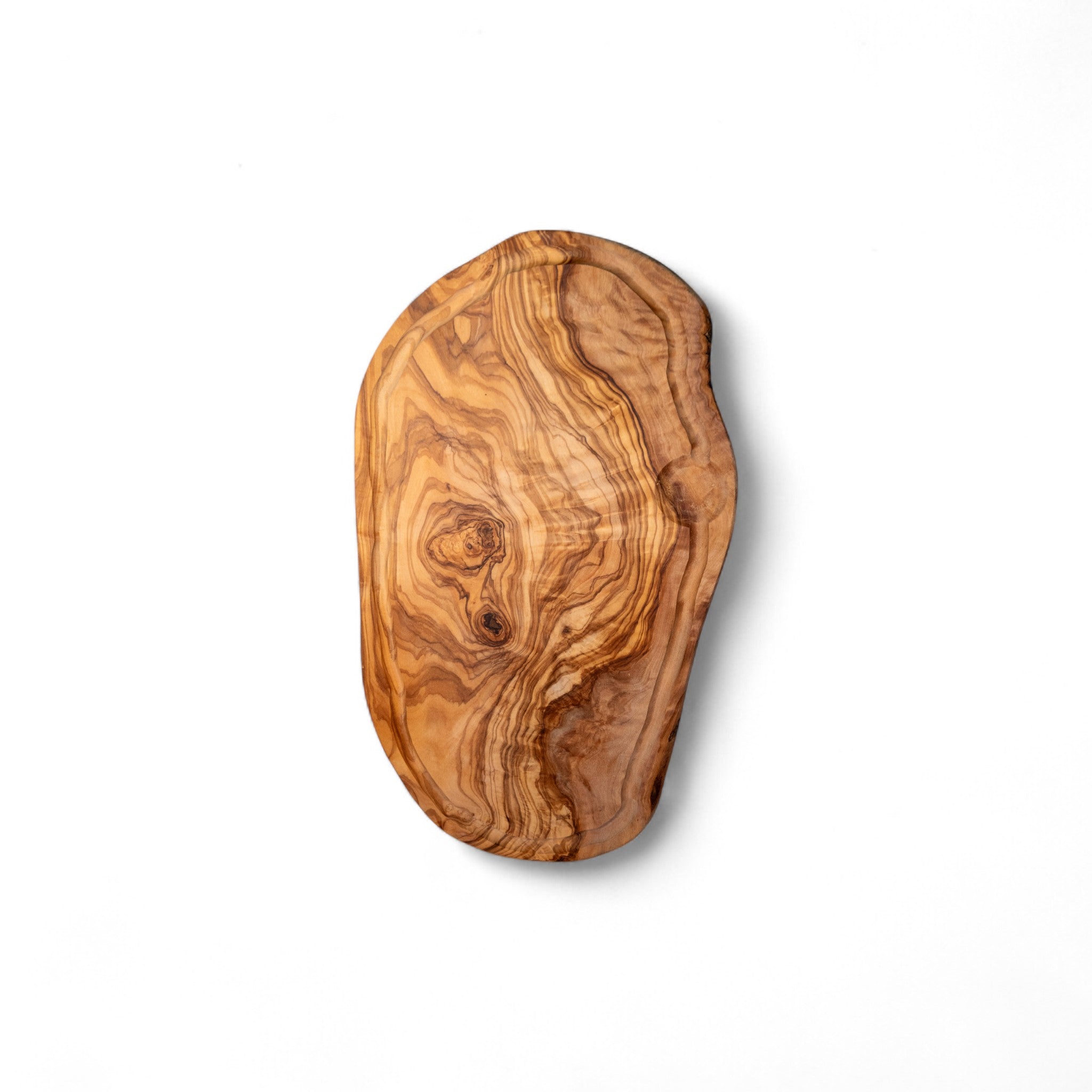 Organic shape olive wood charcuterie board with swirling golden brown grain
