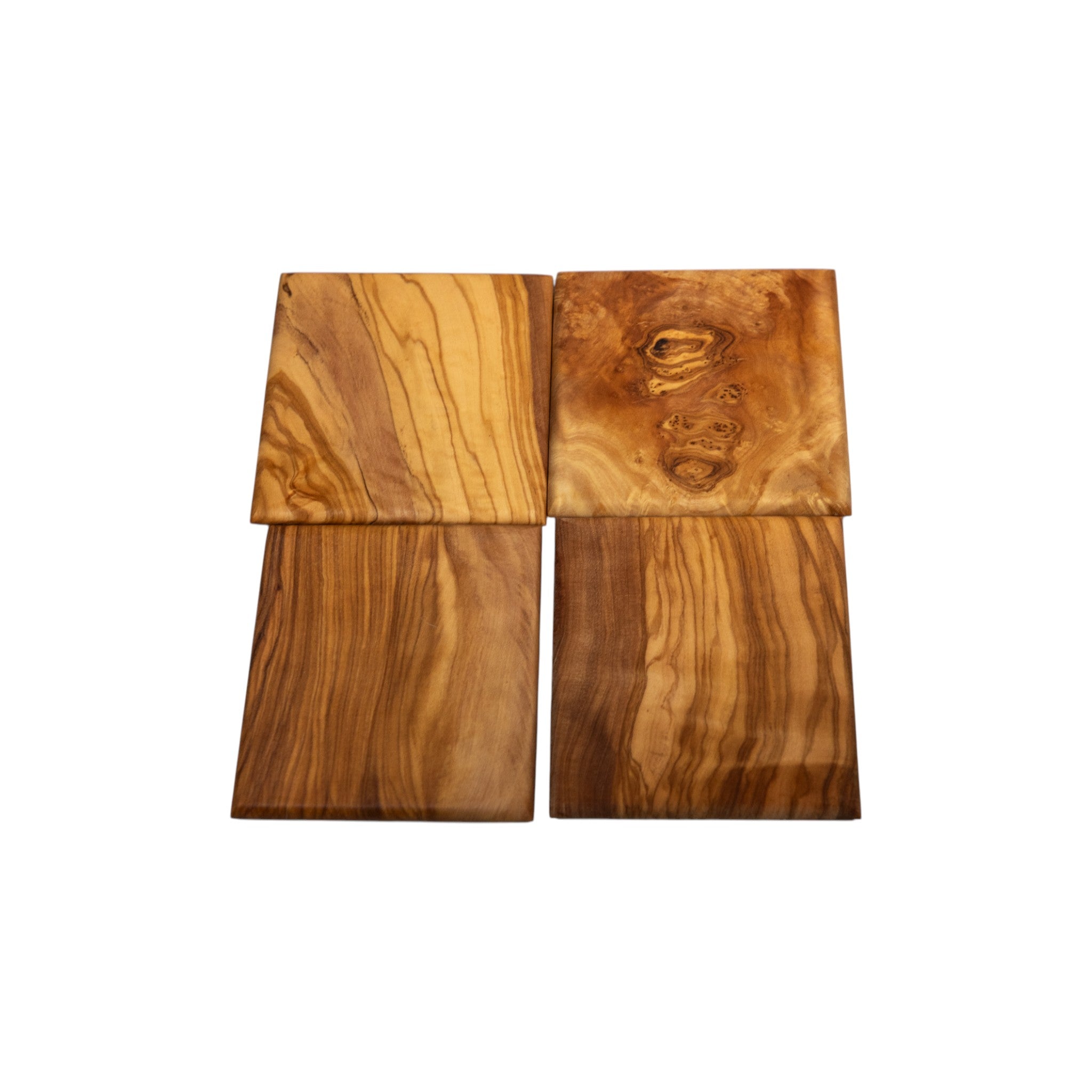 Four solid olive wood coasters featuring unique burl and swirl grain