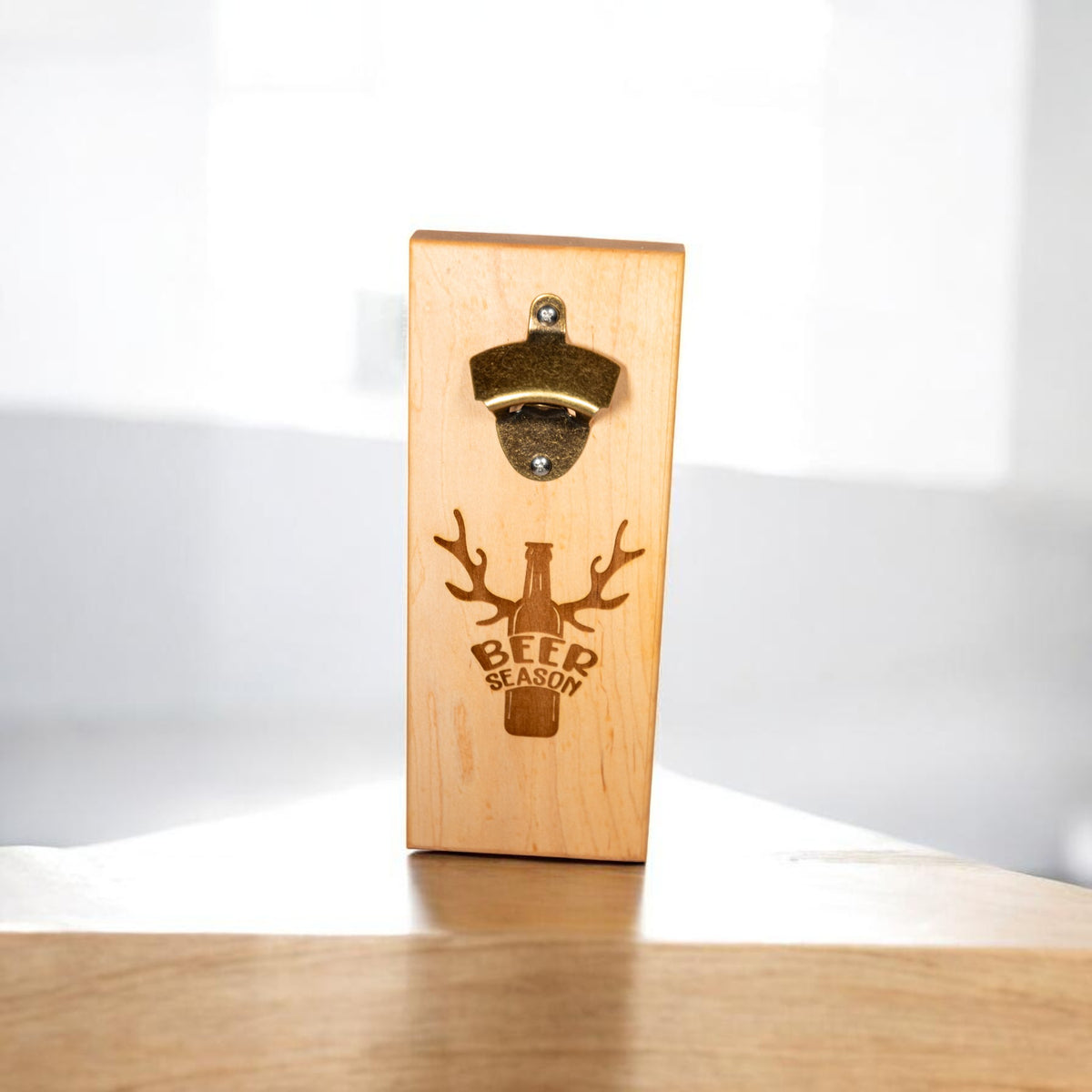 Beer Season wall mounted magnetic bottle opener with brass opener and antler engraving
