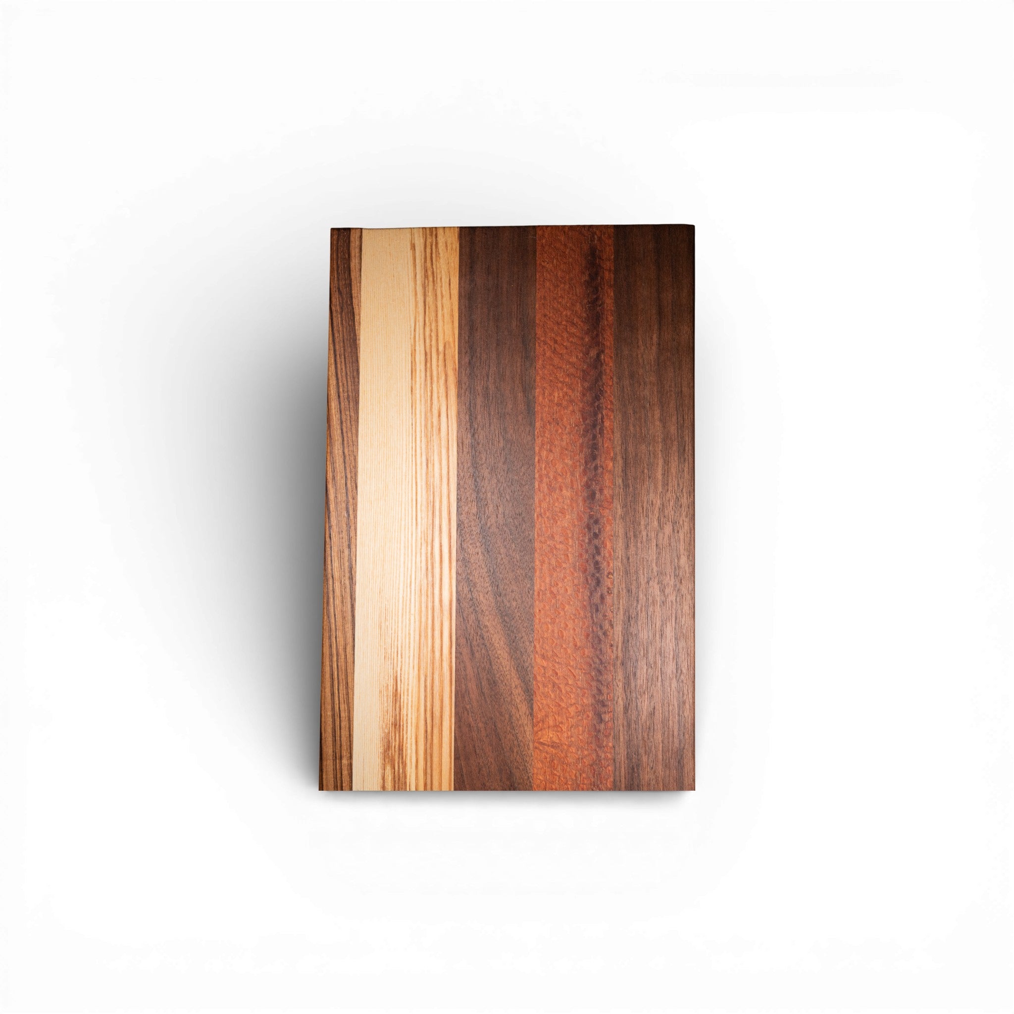 Multi-wood serving board featuring walnut and zebra wood vertical panels