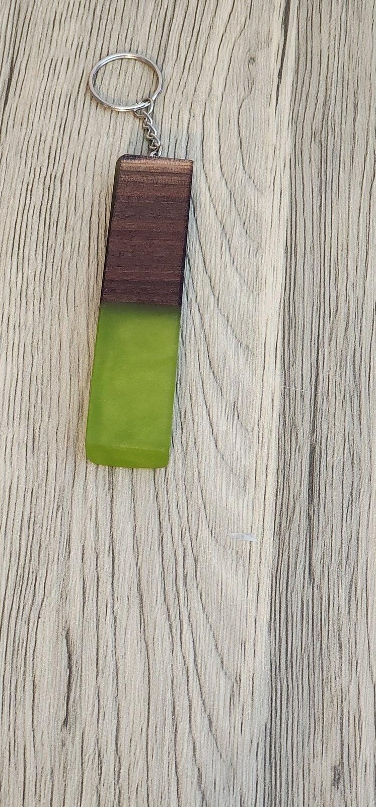 Lime green epoxy and dark wood keychain with visible knots