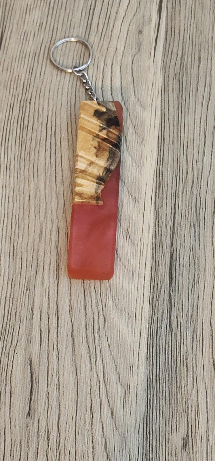 Reddish-orange epoxy and cherry wood keychain with grain