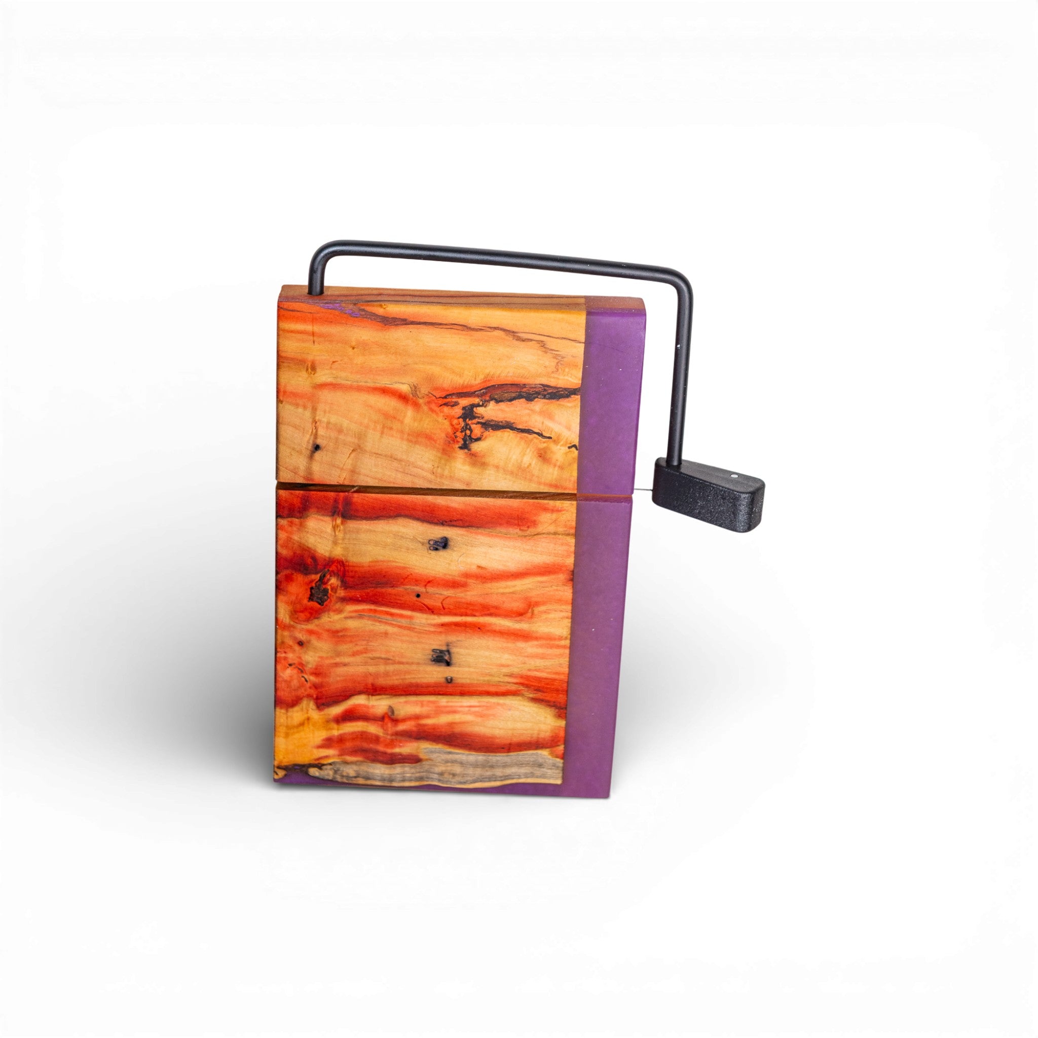 Front view of orange red yellow grain Box Elder cheese slicer with purple epoxy border