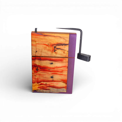 Angled view of thick Box Elder wood cheese slicer board showing purple epoxy contrast