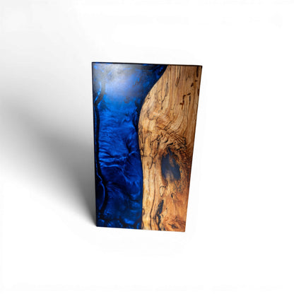 Live edge sapwood maple charcuterie board with flowing dark blue epoxy resin