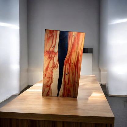Box Elder wood charcuterie board with dark blue epoxy river detail