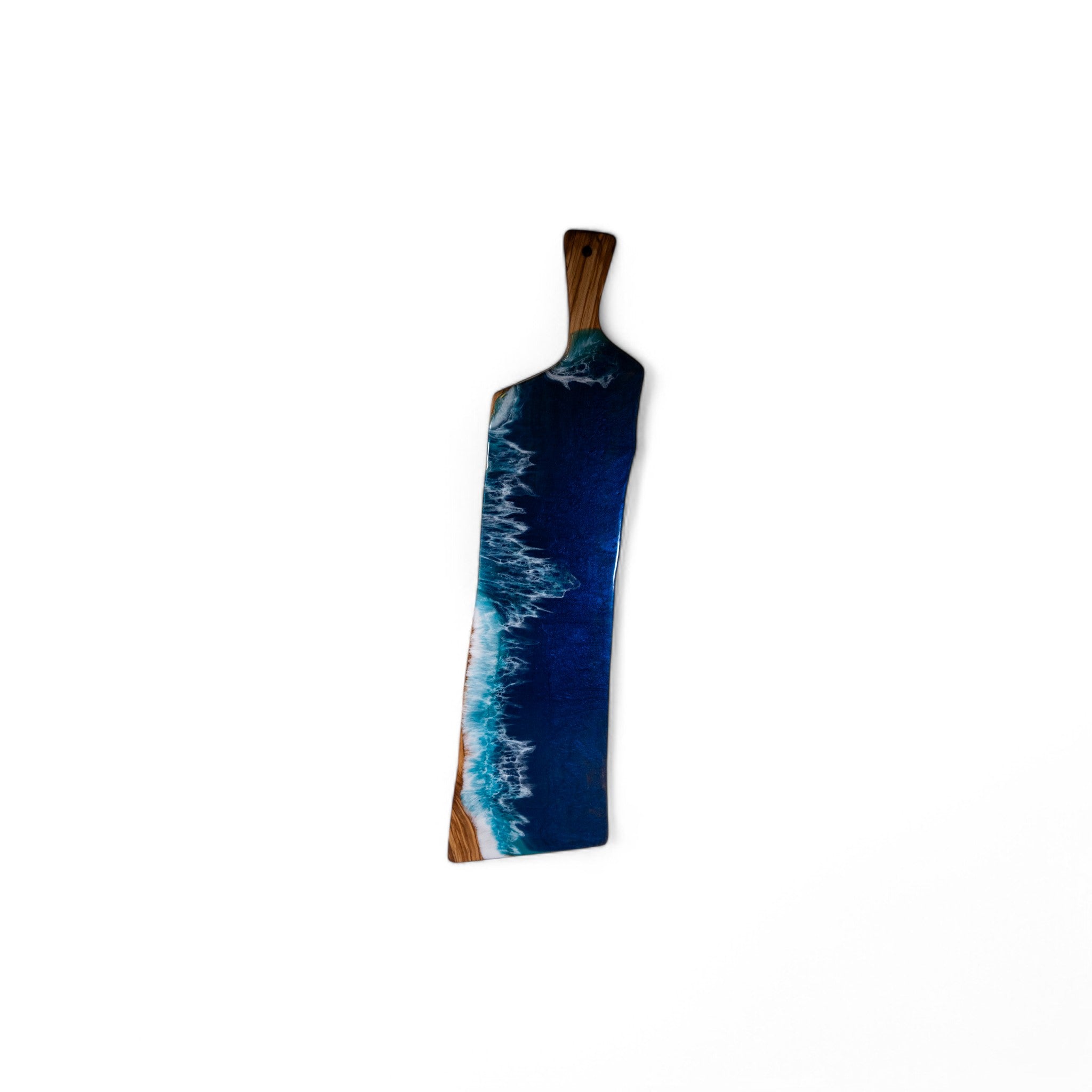 Natural edge olive wood board with turquoise and white resin ocean wave inlay