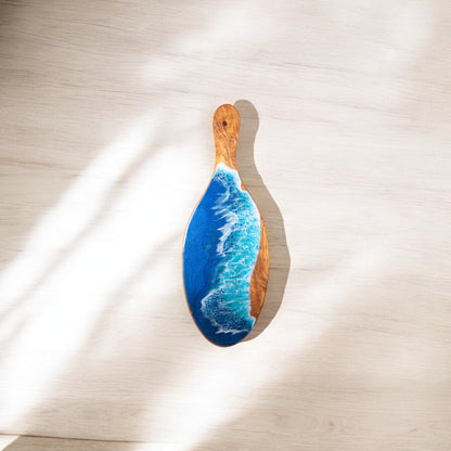 Handcrafted olive wood serving platter with natural grain and resin