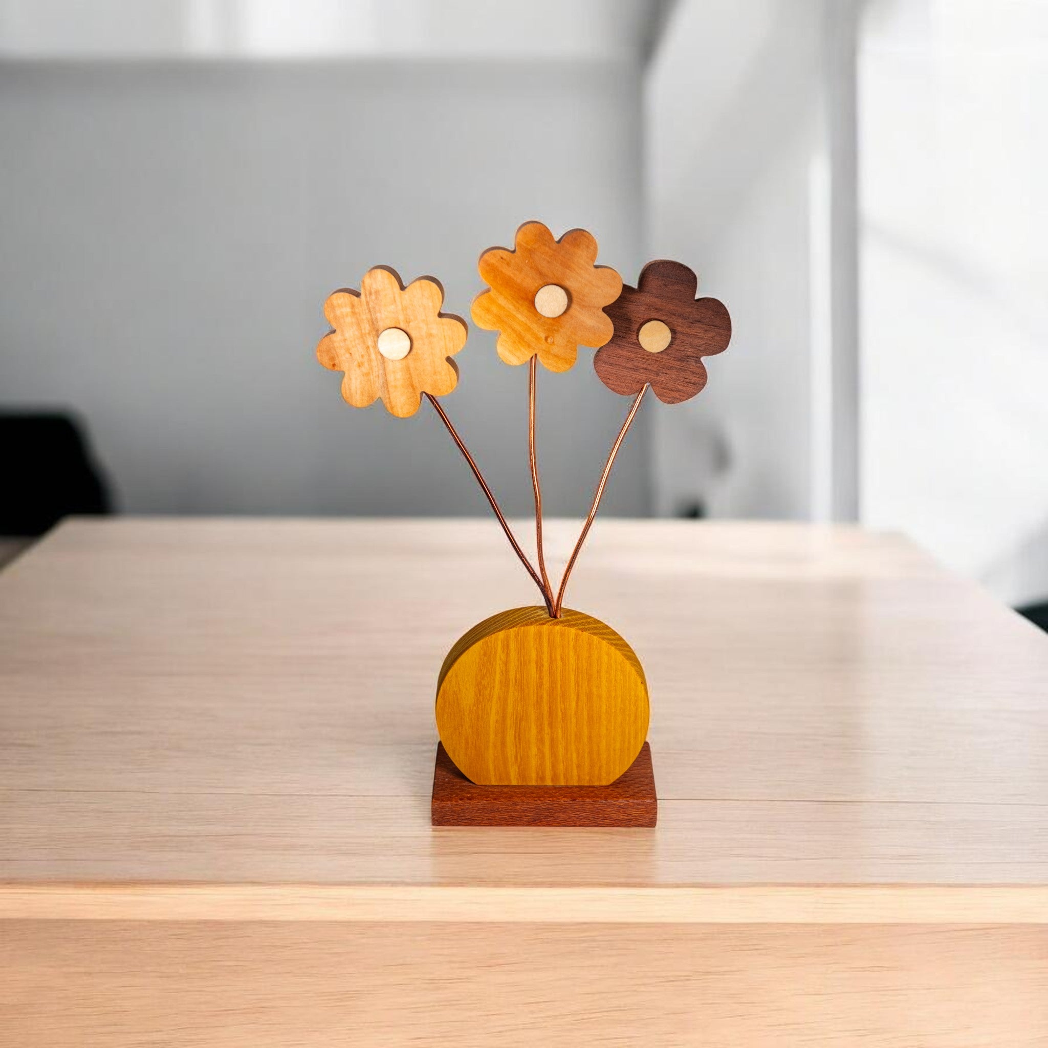 Wooden daisy home decor displayed on light wood table with natural grain finish