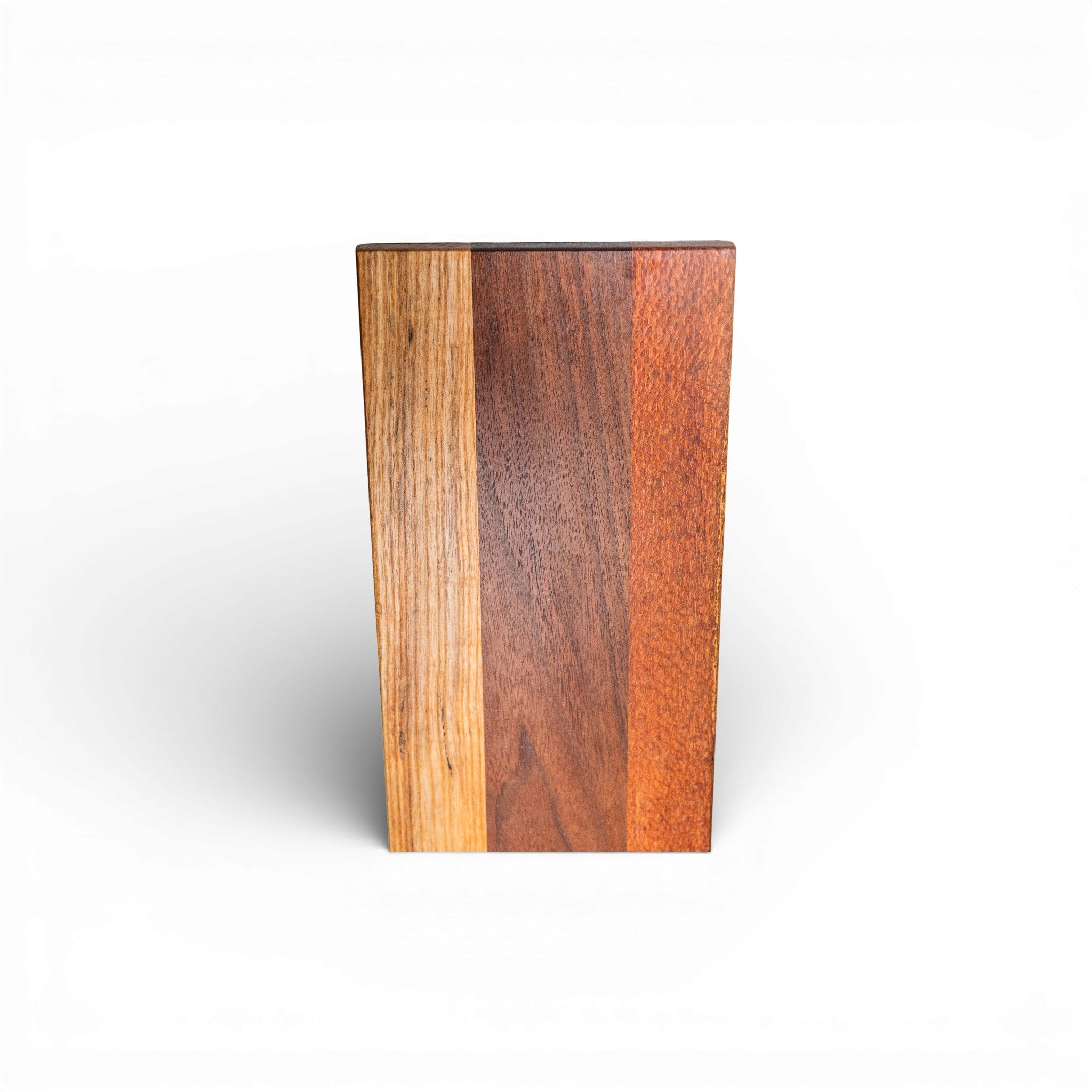 Three-tone wood cutting board featuring lacewood hickory and walnut panels