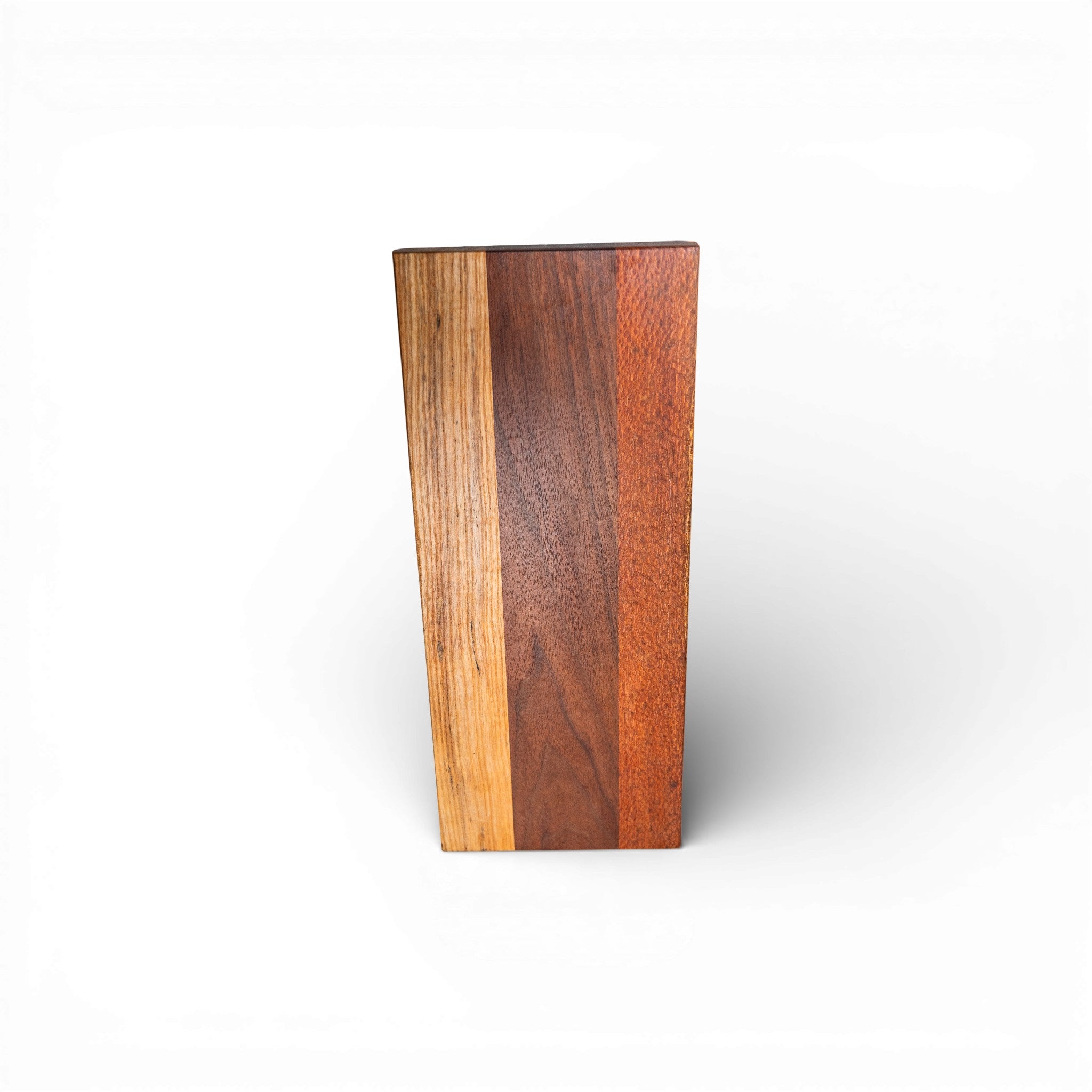 Polished multi-wood charcuterie board showcasing lace hickory walnut texture