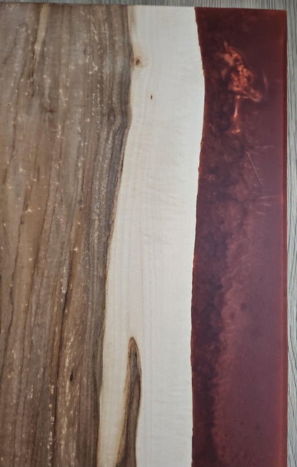 Textured maple grain and smooth copper epoxy contrast on charcuterie board
