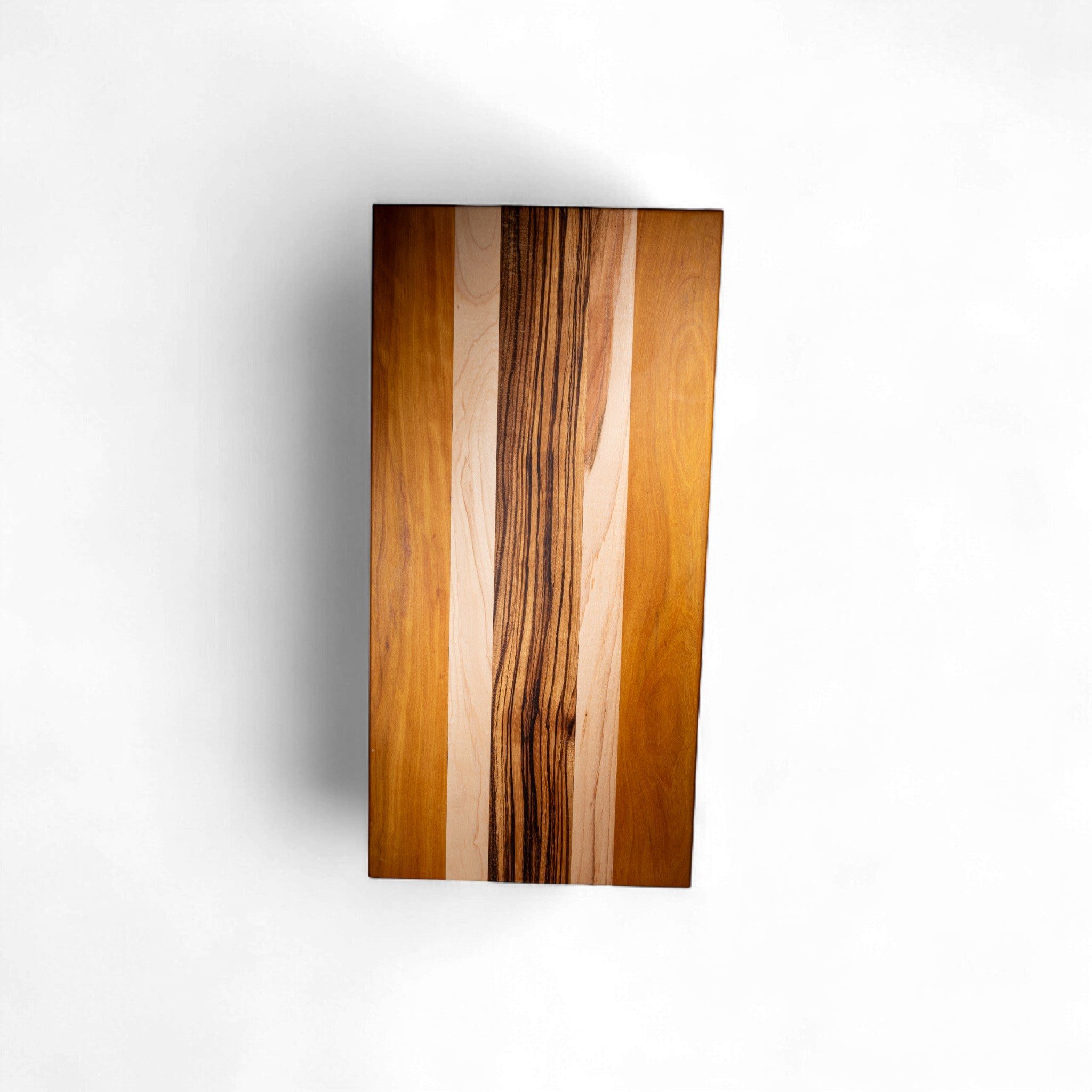 Rectangular charcuterie board with amber maple and warm yellow heart wood finish