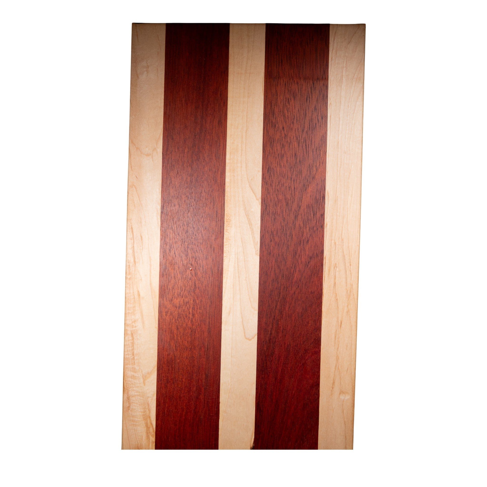 Flat maple and padauk wood cutting board showing natural grain