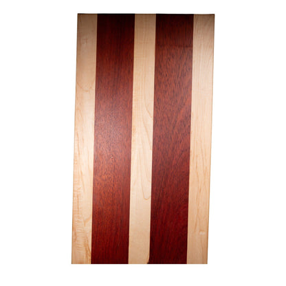 Flat maple and padauk wood cutting board showing natural grain