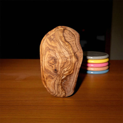 Olive wood charcuterie board with juice groove and natural irregular edge