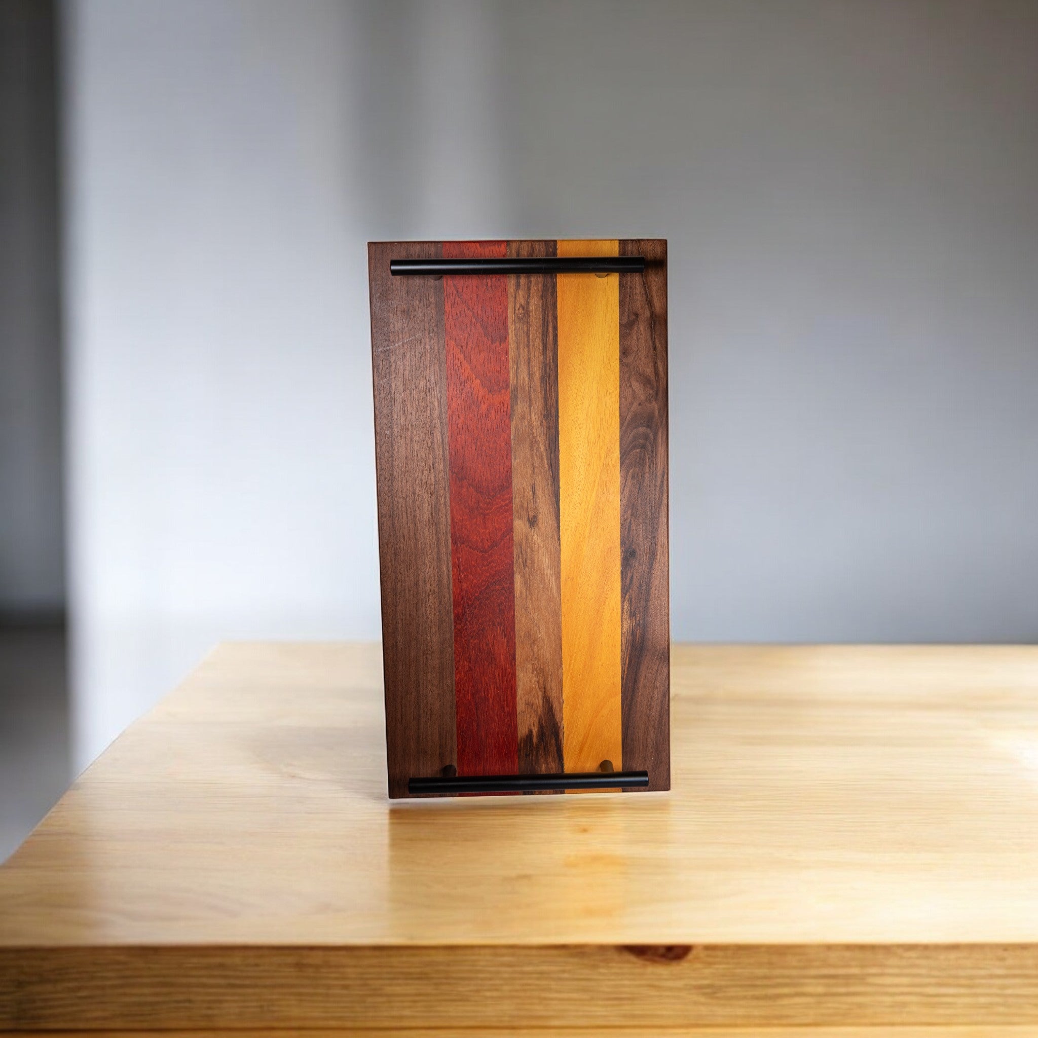 Padauk walnut osage wood charcuterie board with dual black metal handles
