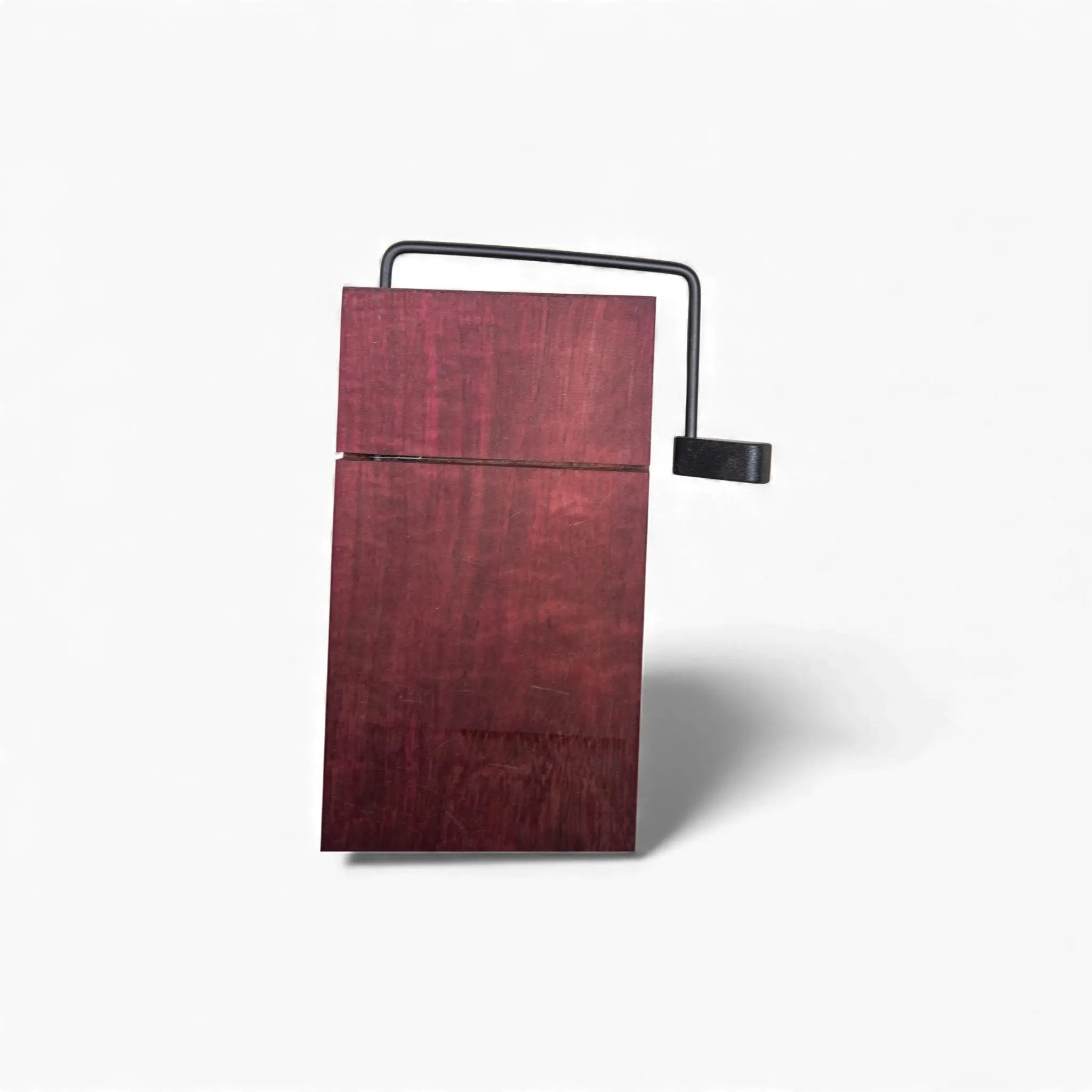 Rectangular Purple Heart wood cheese board mounted on black metal support structure