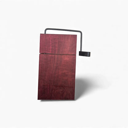 Rectangular Purple Heart wood cheese board mounted on black metal support structure