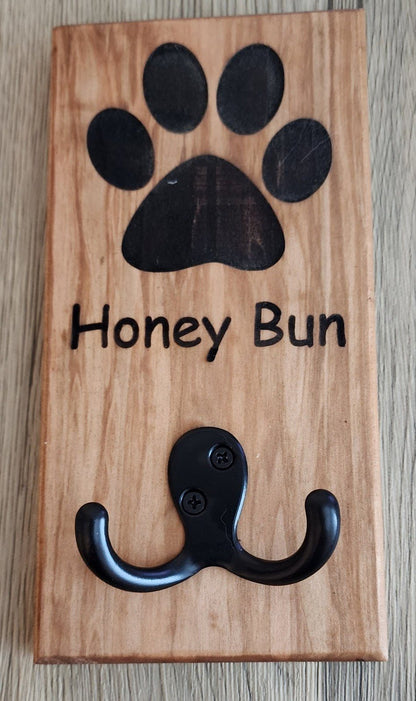 Personalized wooden dog leash holder engraved with 'Honey Bun' and double hook