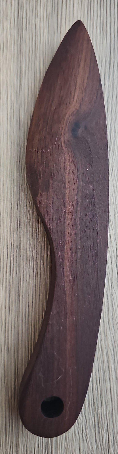 Handmade Eastern Red Cedar butter knife with polished finish and natural wood grain