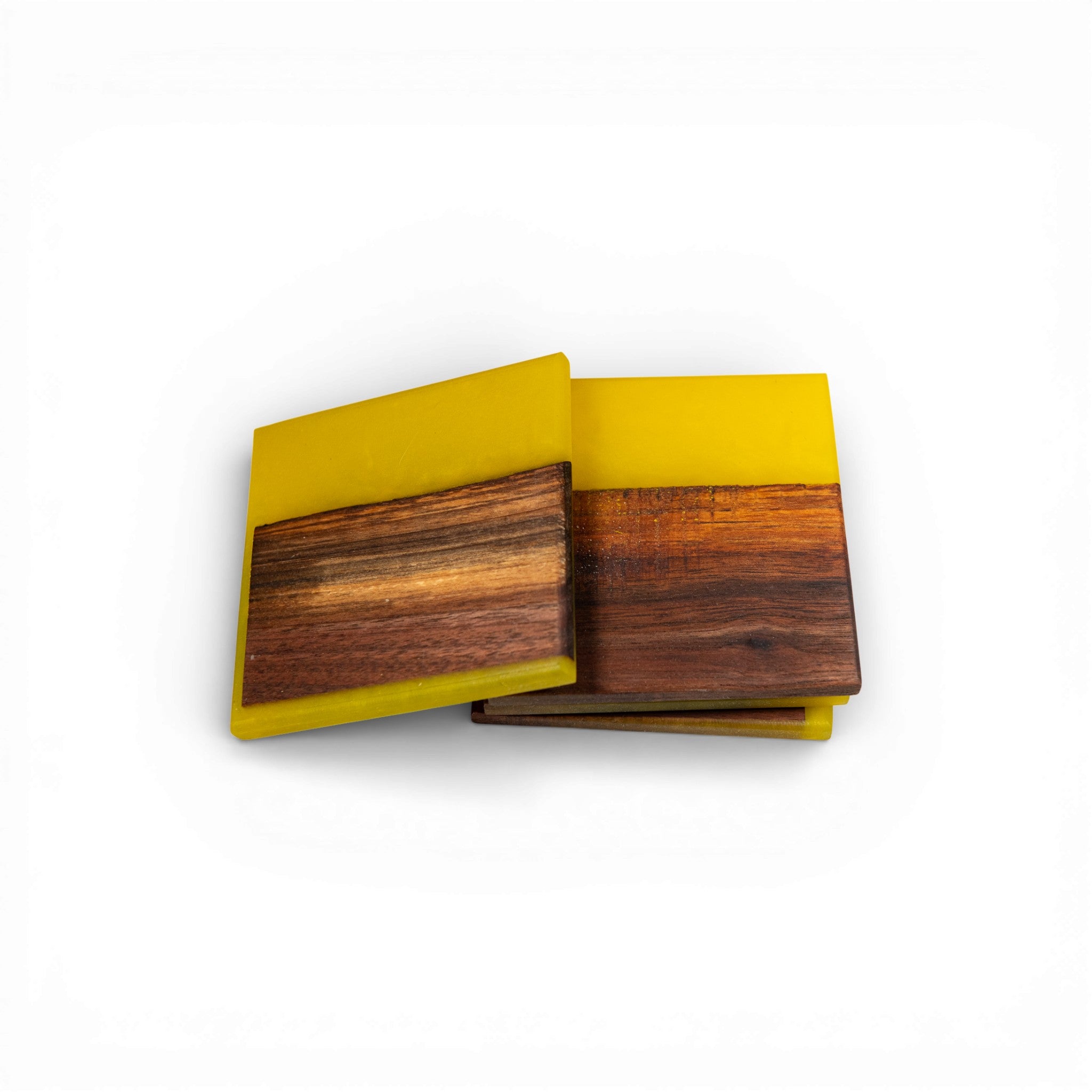 Yellow epoxy resin coaster set featuring dark walnut wood inlay on white background