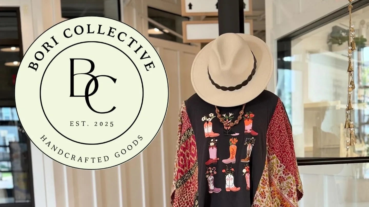 Bori Collective store with a chalkboard sign and clothing on display