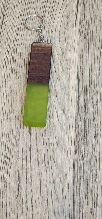 Lime green epoxy and dark wood keychain with visible knots